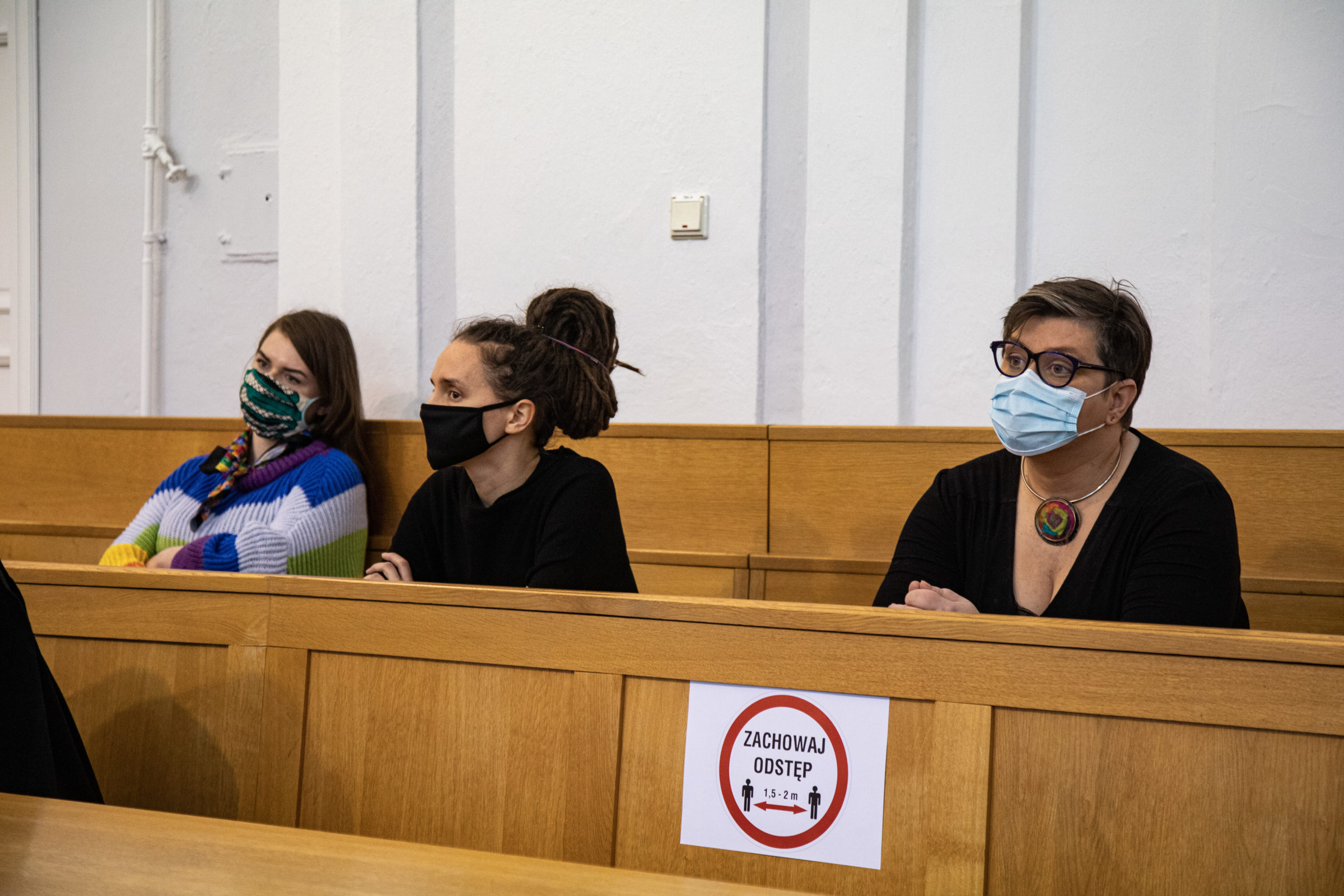 The three defendants sit in court in Poland
