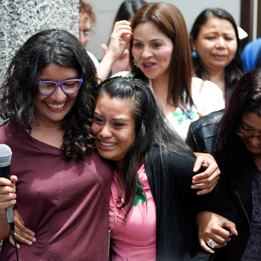 Evelyn Hernandez embraces activist Mariana Moisa after being absolved at a hearing in Ciudad Delgado, El Salvador.
