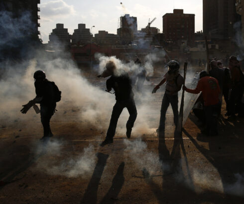 Anti-government protesters clash with police at Altamira square in Caracas March 16, 2014