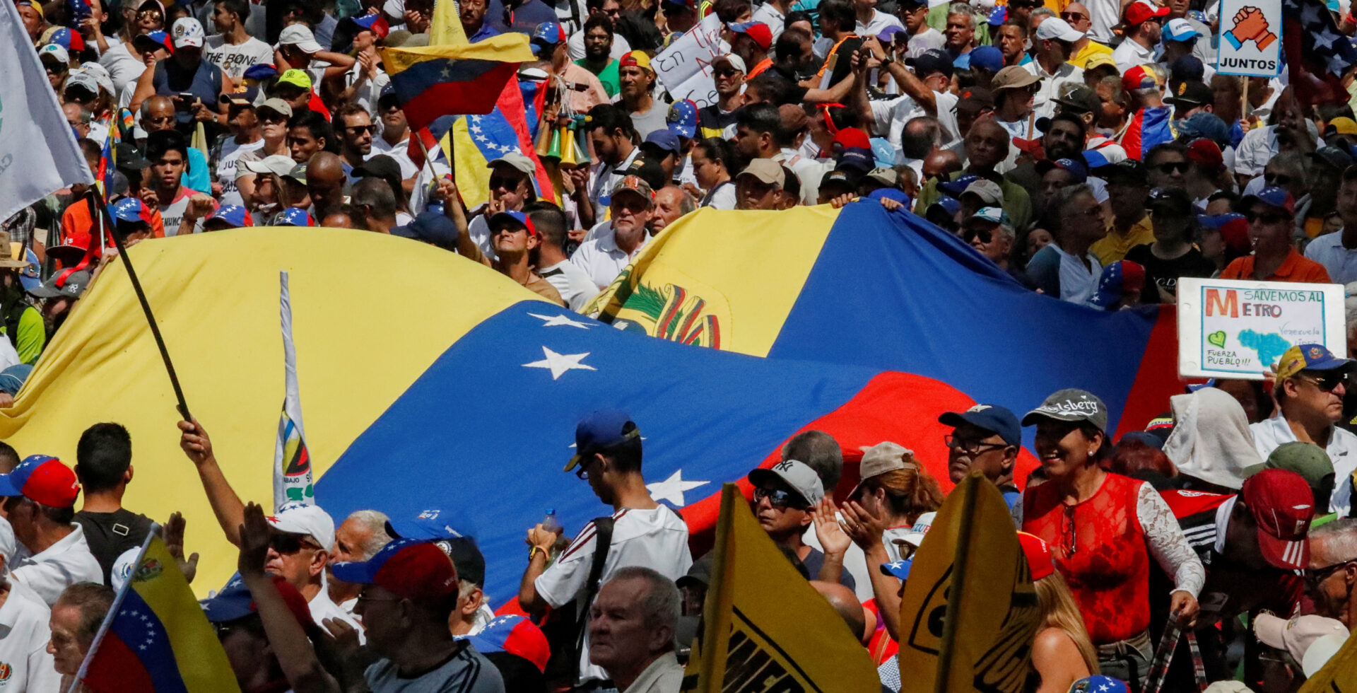 People take part in a protest march against Venezuela's President Nicolas Maduro in Caracas, Venezuela