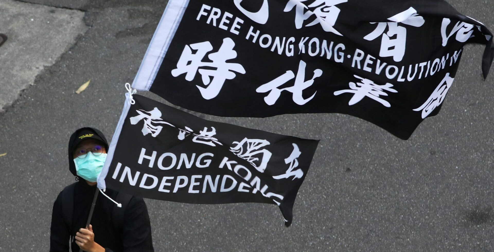 A protester holds a 'Free Hong Kong revolution' flag during a rally in Taipei, Taiwan.