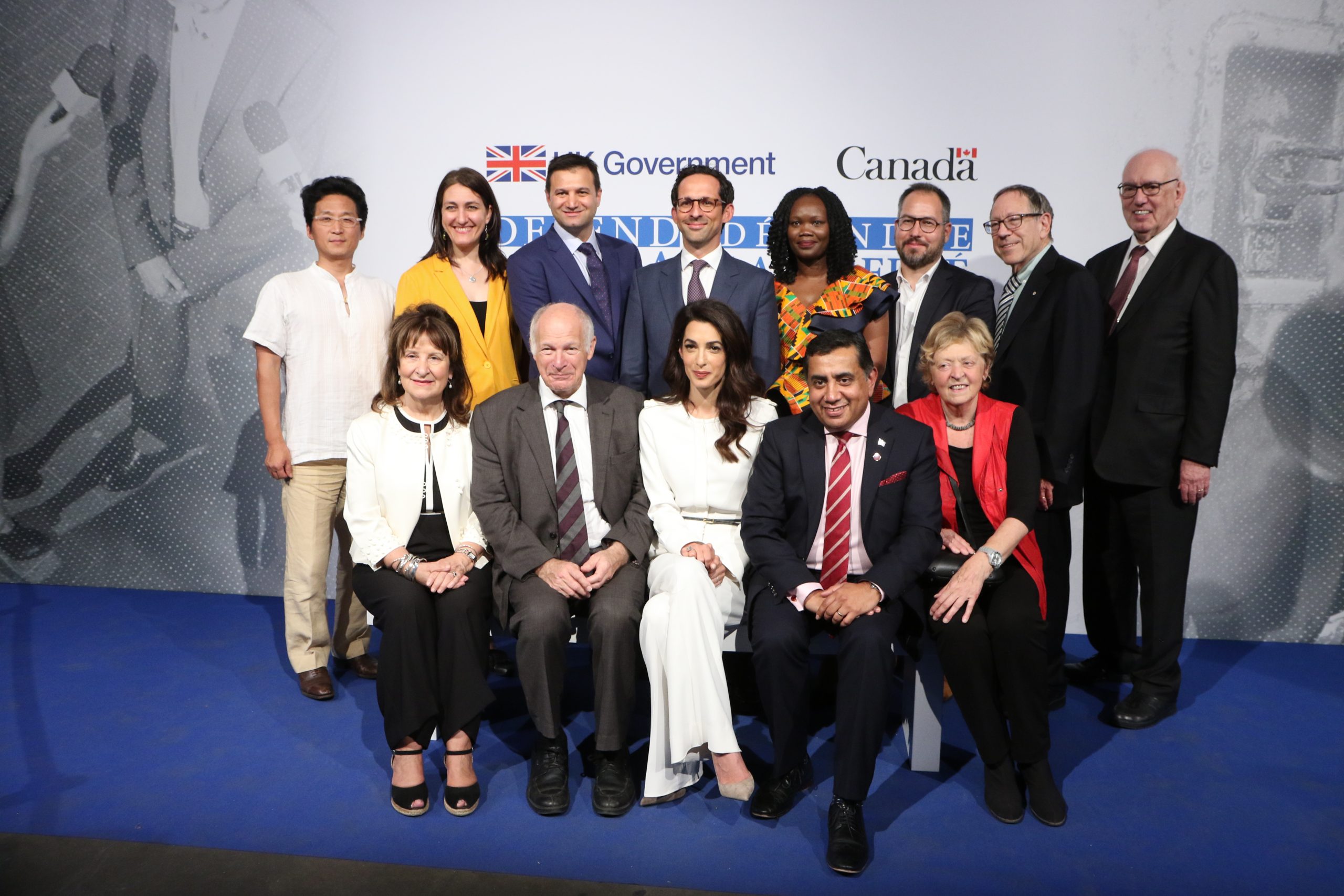 Participants in a panel on media freedom in a group photo with Amal Clooney