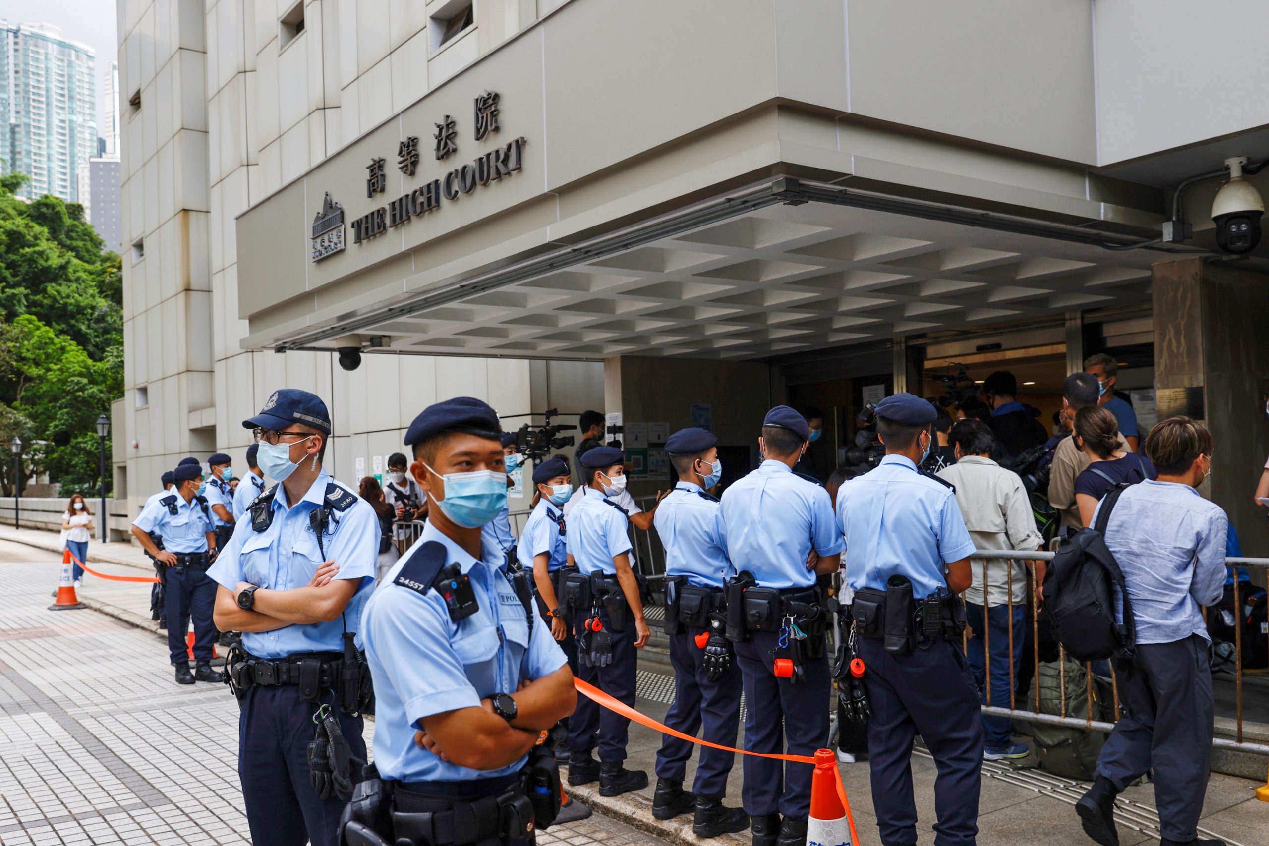 Security forces stand outside the High Court in Hong Kong