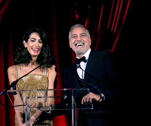 Amal Clooney and George Clooney speak onstage at the Clooney Foundation For Justice Inaugural Albies ceremony