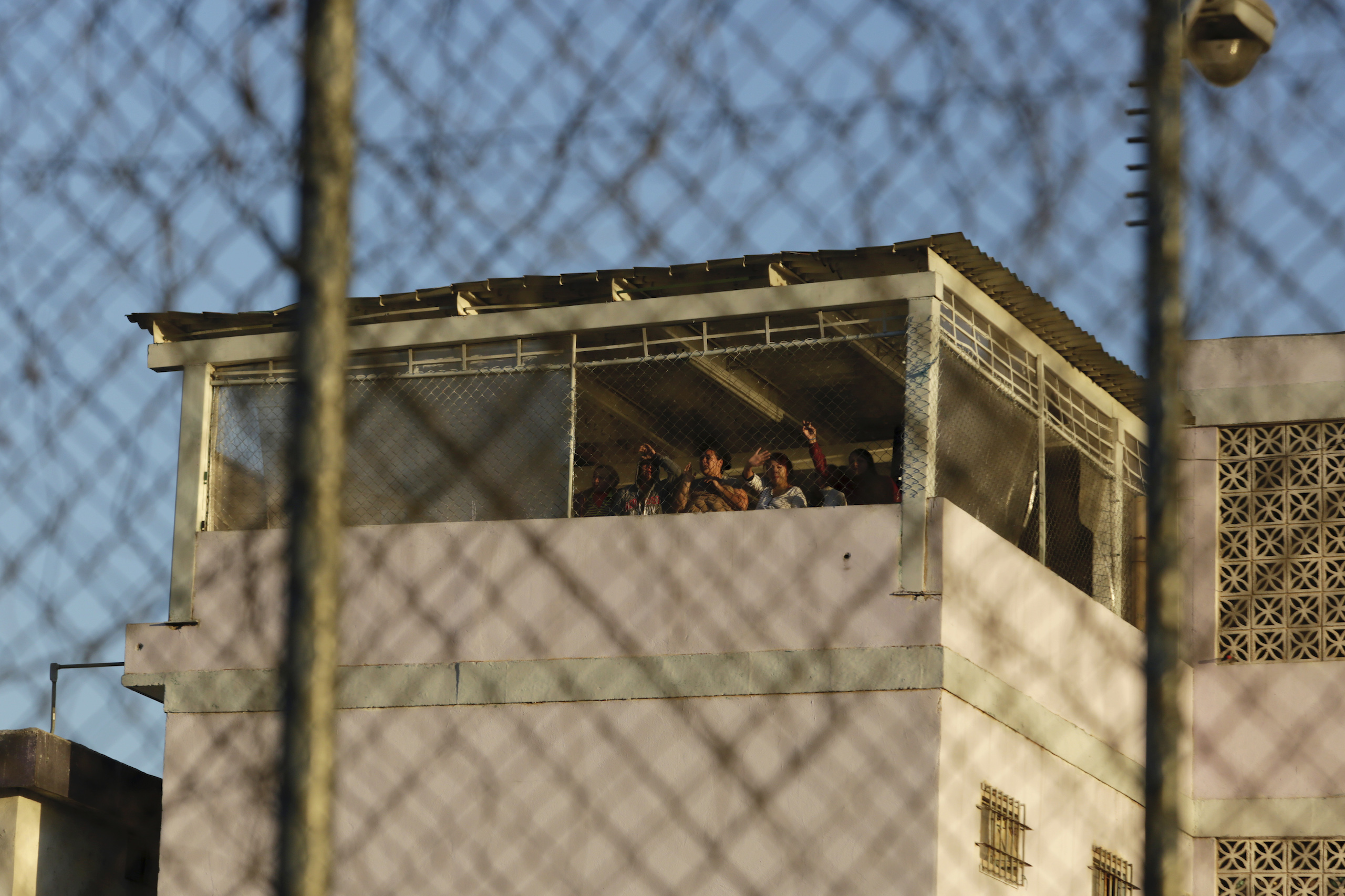 Female inmates look out of the Top Chico prison in Monterrey