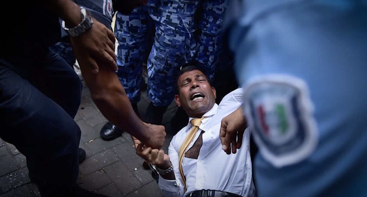 Former President of the Maldives being arrested by the police