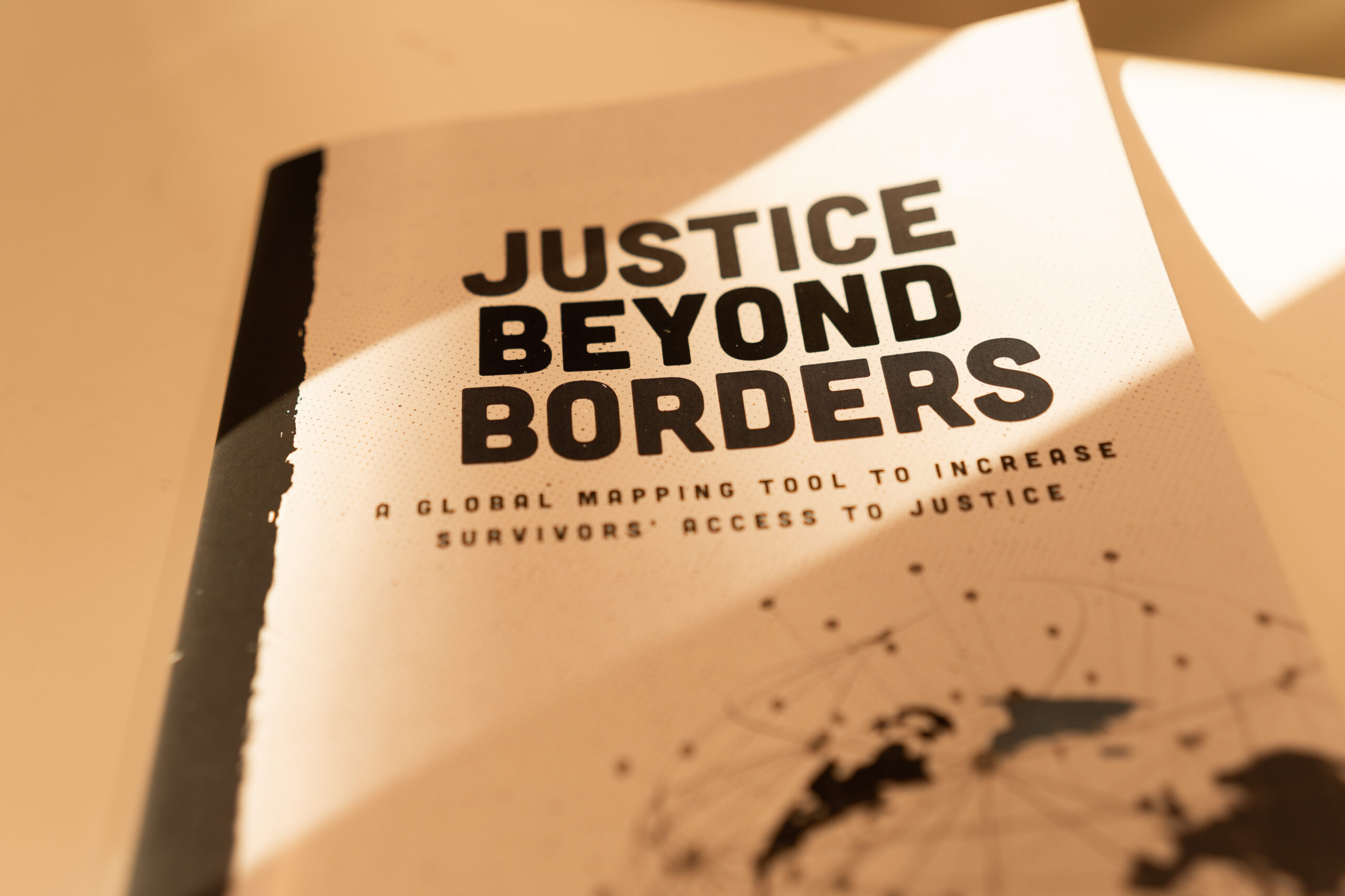 Cover of our Justice Beyond Borders report
