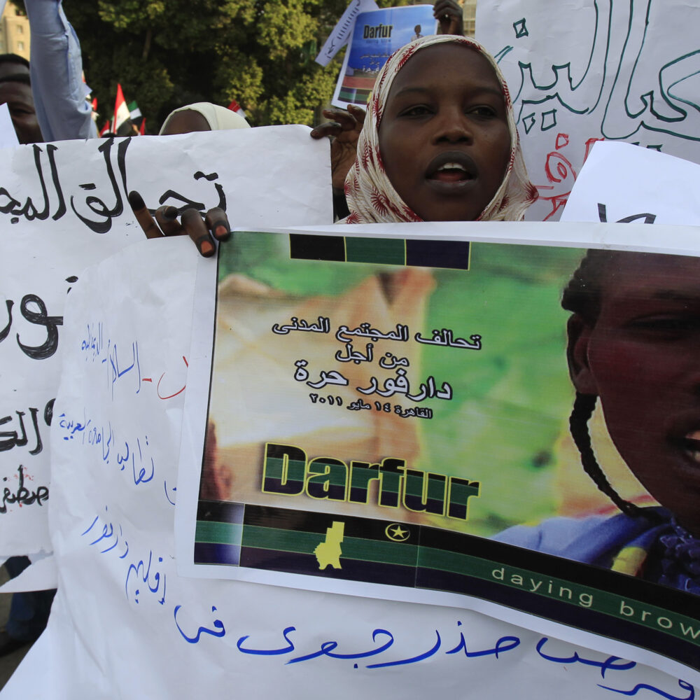 Sudanese protesters from Darfur chant slogans during a protest demanding Sudanese President Omar Al-Bashir to step down