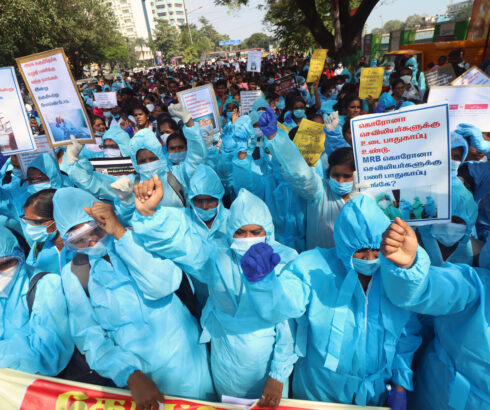 Covid nurses participate in a protest demanding the cancellation of dismissal order and regularization of services in India.