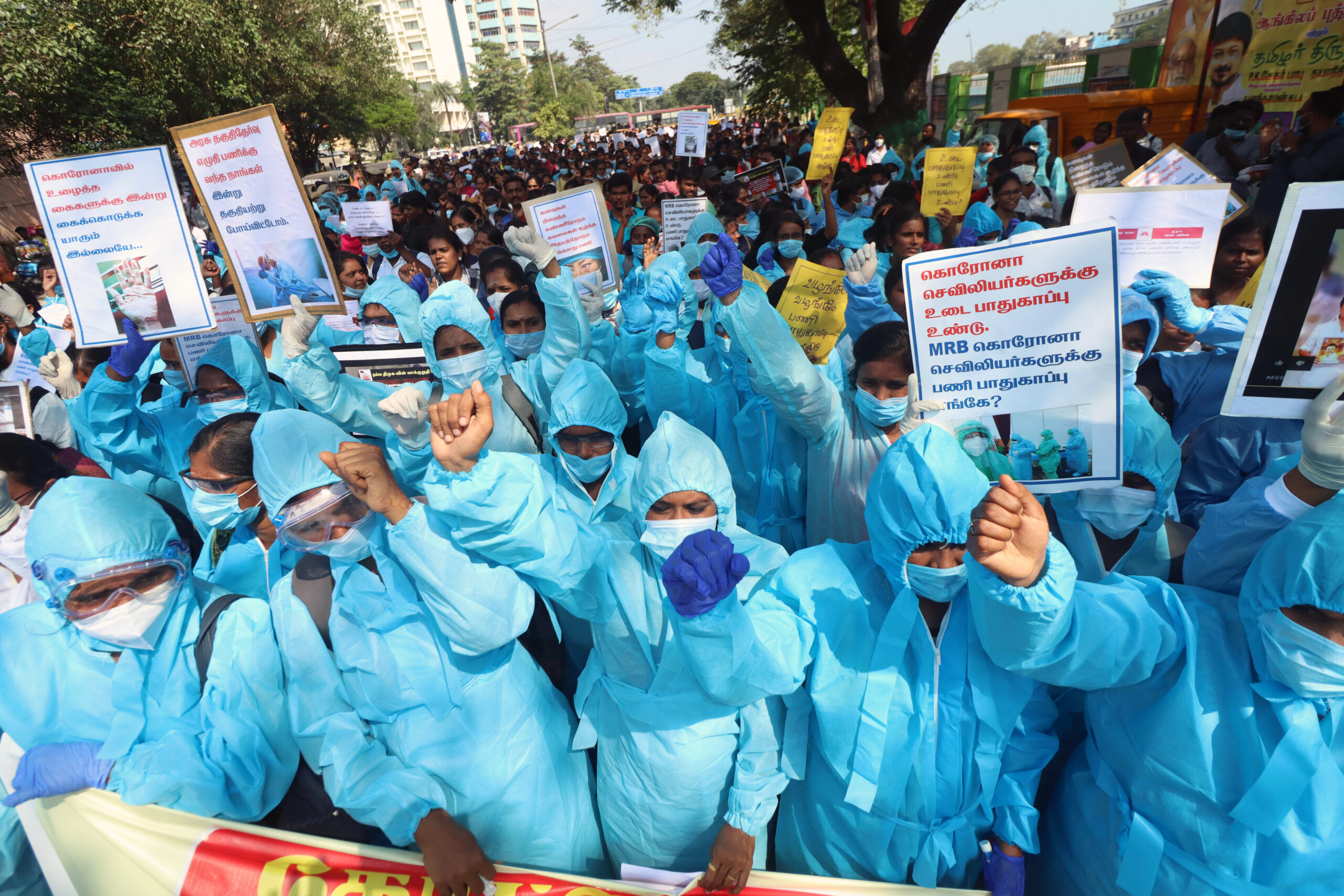 Covid nurses participate in a protest demanding the cancellation of dismissal order and regularization of services in India.