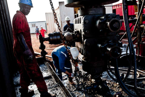 Workers extracting oil