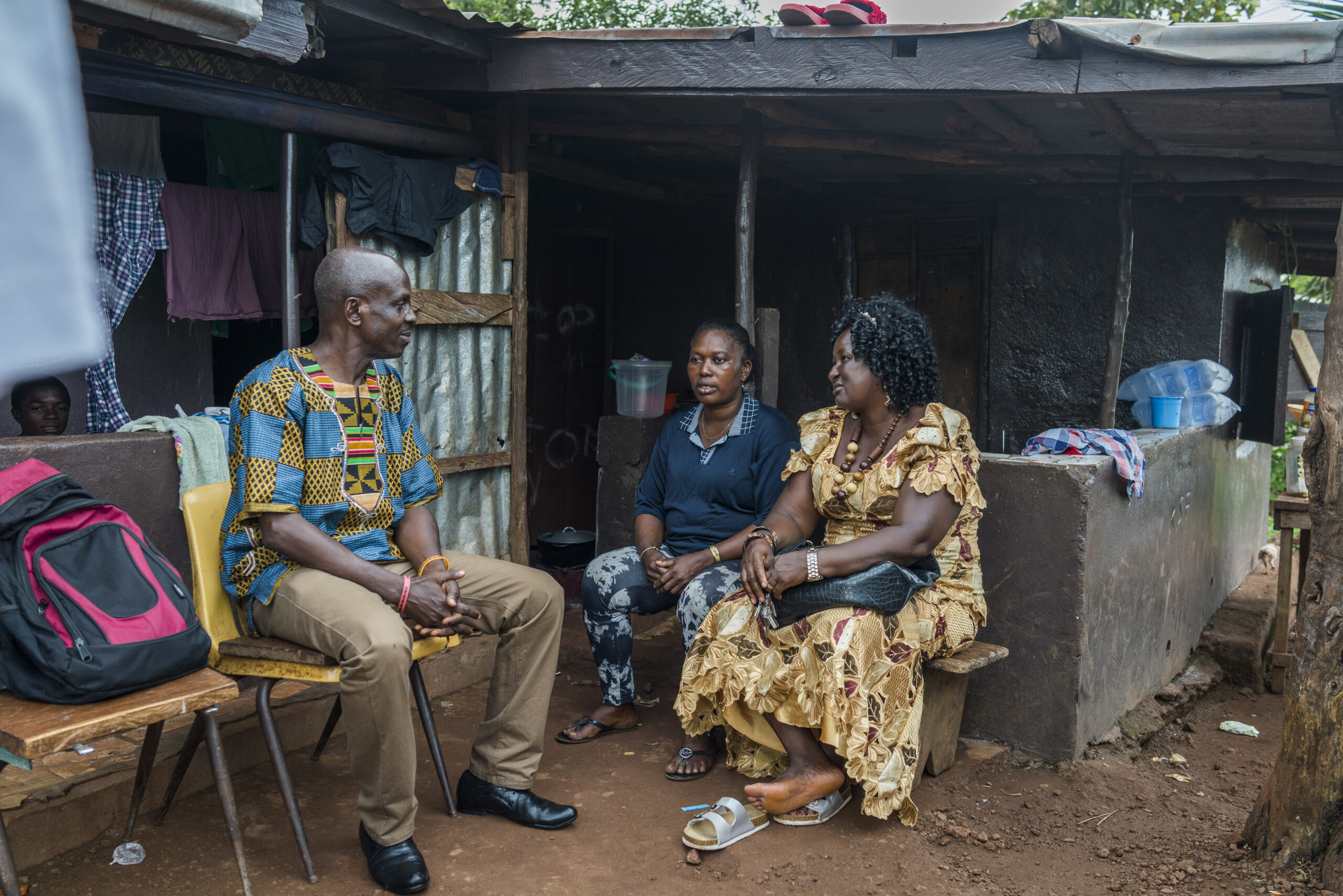 Paralegals providing legal advice to a woman in Freetown, Sierra Leone.