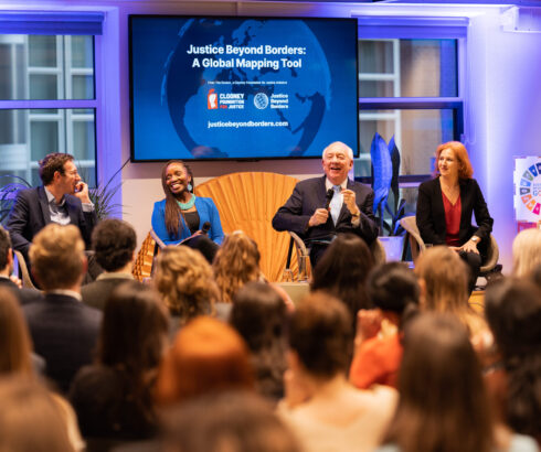 Four experts sit on a panel at the launch of the Clooney Foundation for Justice's Justice Beyond Borders project