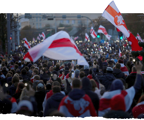 Protesters hold pre-Soviet era Belarusian red-and-white striped flags with an equestrian knight at their centre