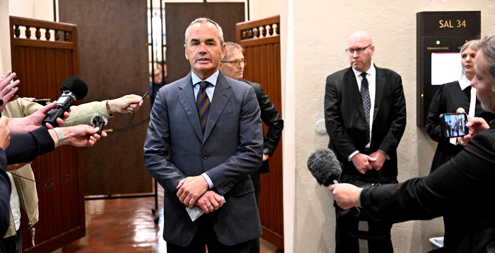 Former Lundin Oil chairmanIan Lundin arrives in court in Stockholm. He and ex-Lundin executive Alex Schneiter are charged with aiding and abetting serious violations of international law in Sudan (Reuters)