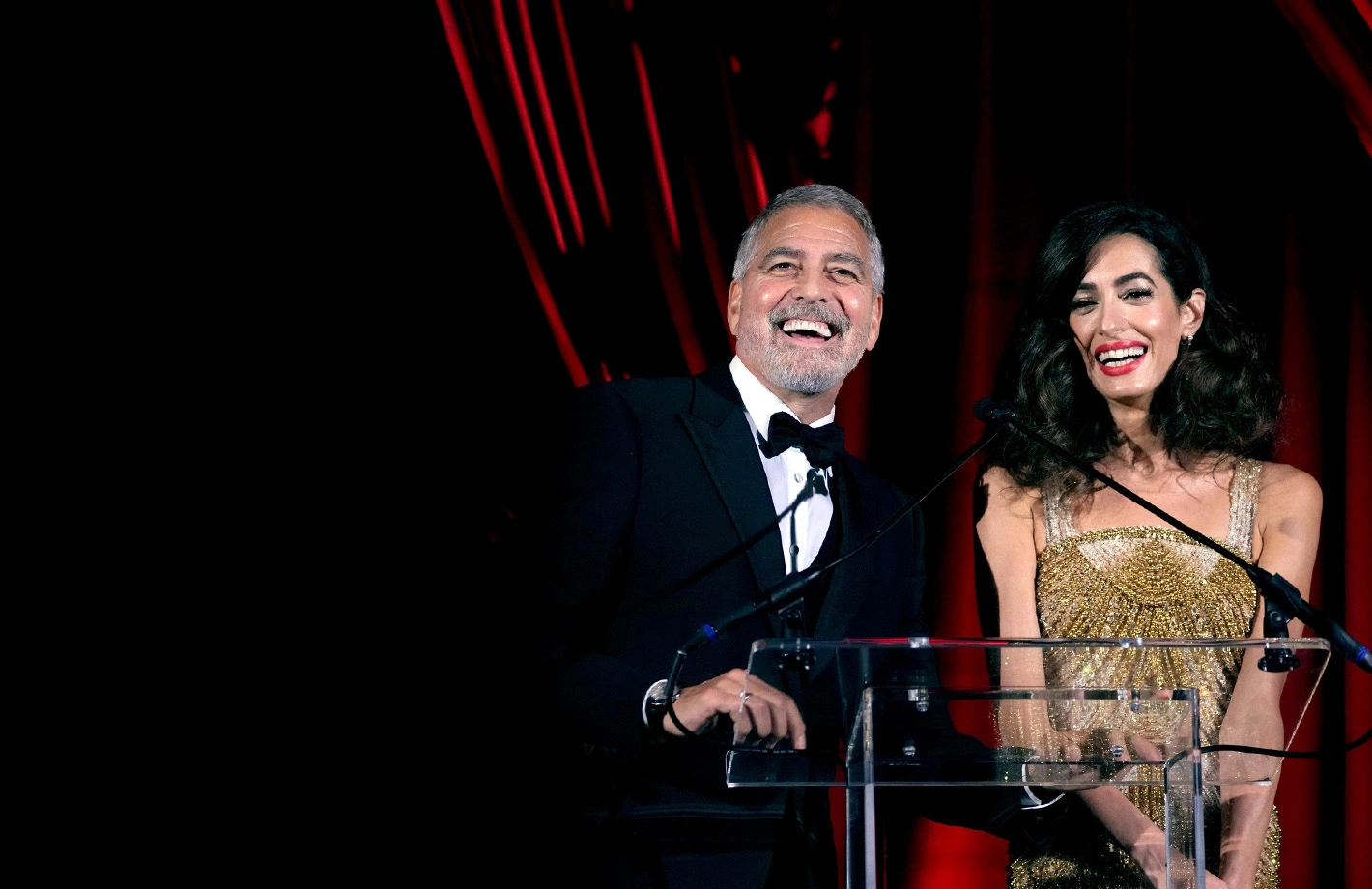 George and Amal Clooney onstage at the inaugural Albies in 2022