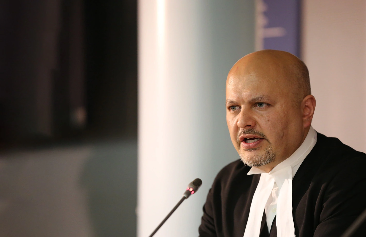 ICC Prosecutor Karim A. A. Khan KC speaking at a microphone
