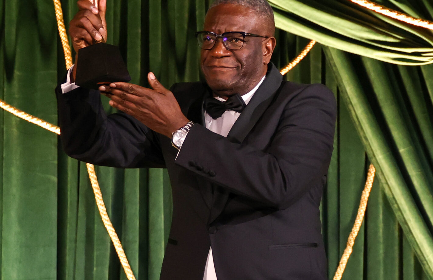 Dr Denis Mukwege holds his lifetime achievement in pursuit of justice award at the 2023 Albies