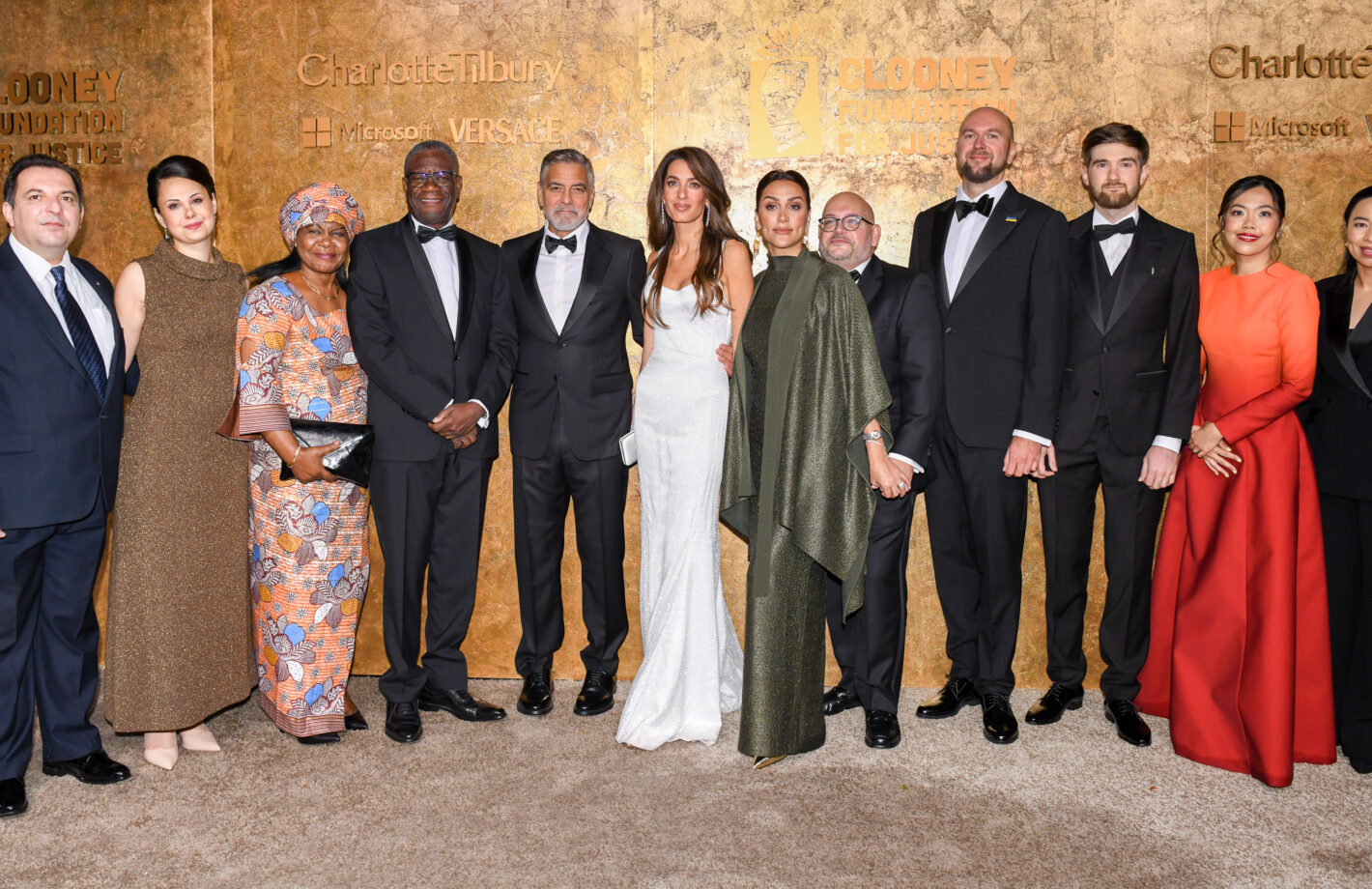 Amal and George Clooney with the winners of the 2023 Albies