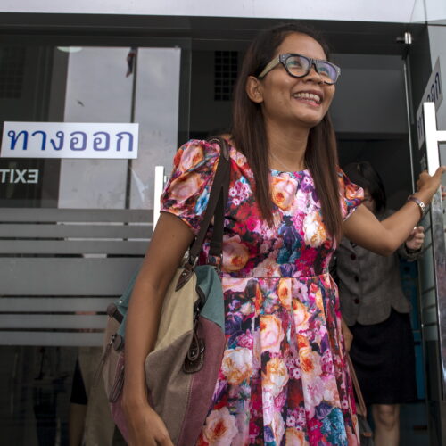Thai journalist Chutima Sidasathian opens the door as she leaves court in Phuket, Thailand