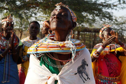 Kenyan FGM survivors participate in a traditional dance at a women-only village.